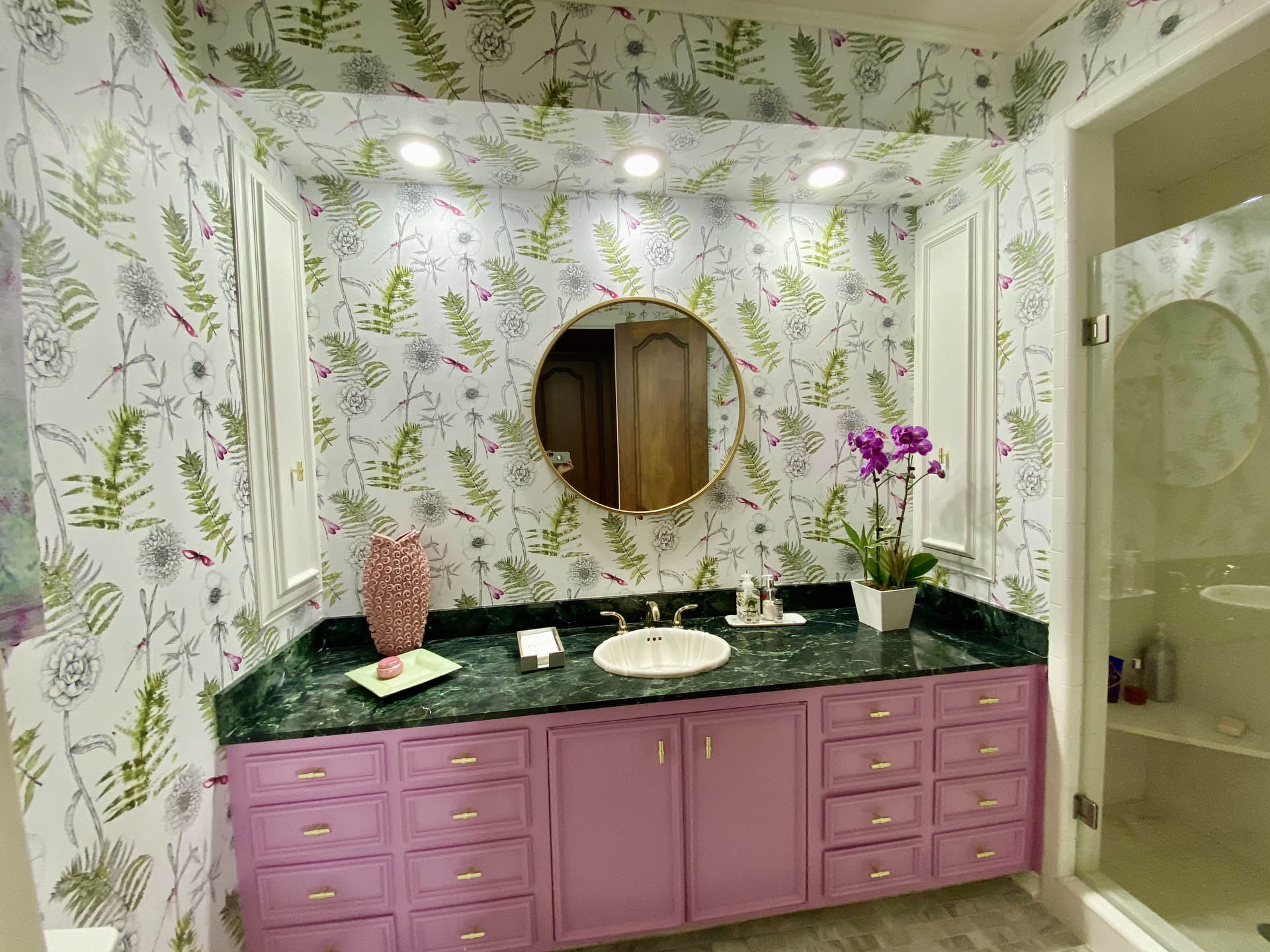bathroom with pink cabinets